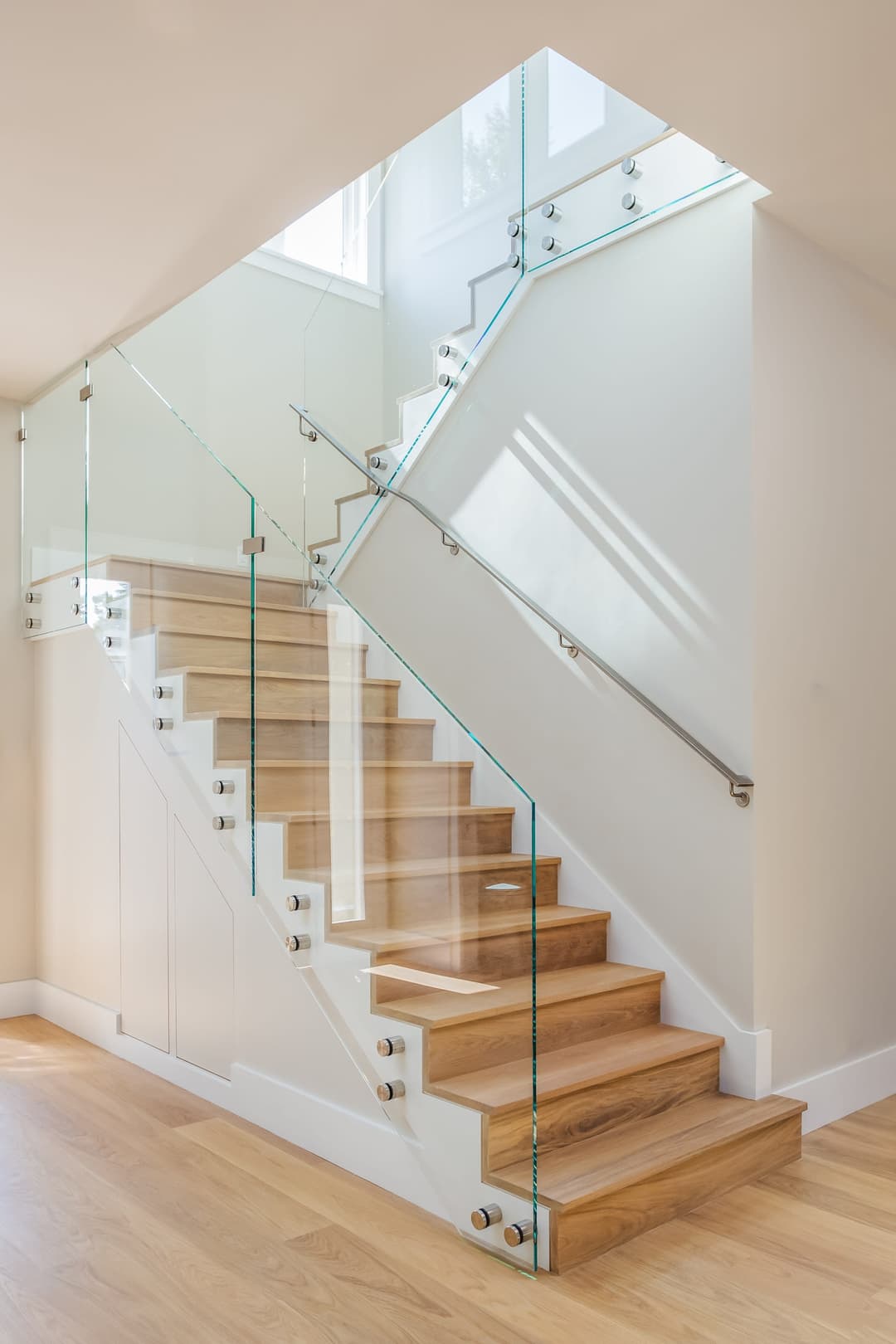 Modern staircase with glass railings